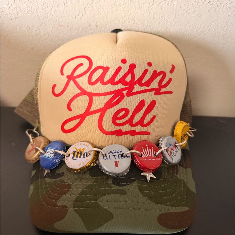 Raisin' Hell Red Script Trucker Hat - Camouflage Bill